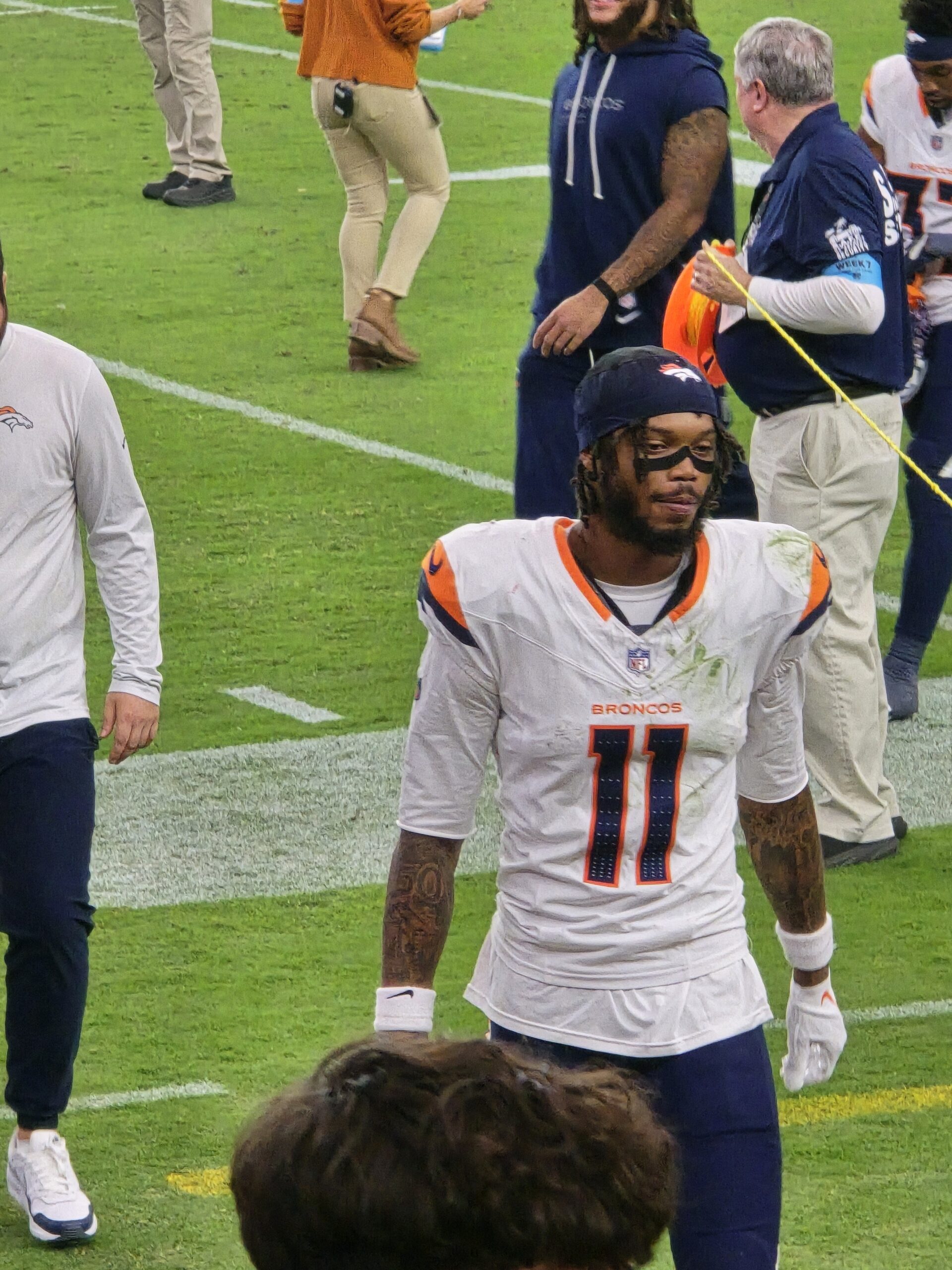 Broncos player walking off the field after the win